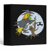 Witch in front of blue moon binders
