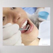 Woman, aged 27, being examined in a dentists posters