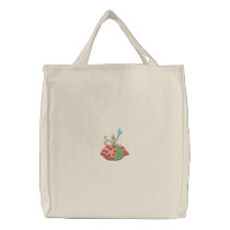 Woman holding butterfly embroidery canvas tote bag