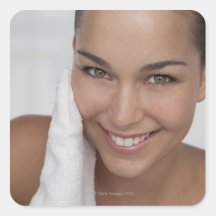 Woman scrubbing her face with cloth sticker