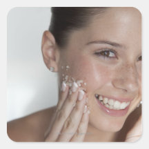 Woman scrubbing sugar on her face sticker