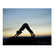 woman silhouetted against the sunset practicing post cards