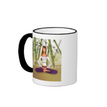 Woman sitting in lotus position, meditating coffee mugs