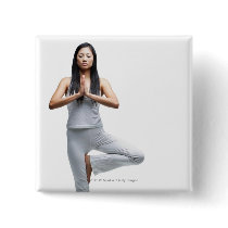 Woman standing in yoga position pinback buttons