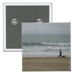 Woman Walking Dog Along Pismo Beach, CA Button