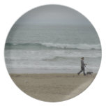 Woman Walking Dog Along Pismo Beach, CA Party Plate
