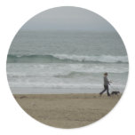 Woman Walking Dog Along Pismo Beach, CA Round Sticker