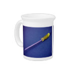Yellow screwdriver on table pitcher