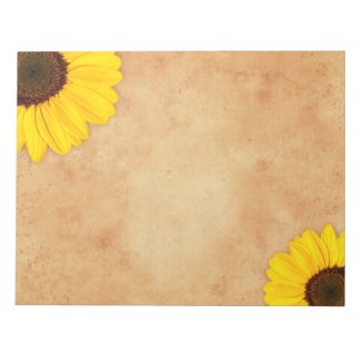 Yellow sunflowers on stained old paper notepad