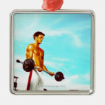 Young man exercising with barbells christmas tree ornaments