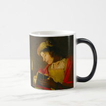 Young man reading by candlelight coffee mugs