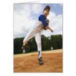 Young pitcher throwing baseball from mound greeting cards