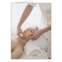 Young woman having facial massage card