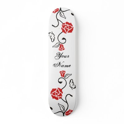 This pretty skate deck features a tattoo like rose vine and butterfly design