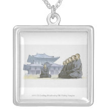 Zen Buddhist monks kneeling outside temple Pendants