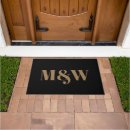 Search for black and gold doormats Couple