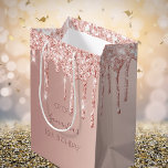 18th birthday 18 rose gold glitter drips medium gift bag<br><div class="desc">A gift bag for a girly and glamorous 18th birthday.  A faux rose gold background with an elegant faux rose gold glitter drips,  paint drip look. The text: The name is written in dark rose gold with a modern hand lettered style script. Tempate for a date and age 18.</div>