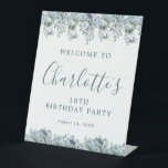 18th Birthday Dusty Blue Floral Welcome Pedestal Sign<br><div class="desc">Welcome your guests with this elegant tabletop pedestal sign. Pretty dusty blue roses,  peonies and wildflowers decorate the top and border. A classic and easy-to-read font combination takes only minutes to personalize.</div>