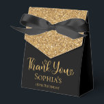 18th Birthday Gold Glitter Thank You Favor Boxes<br><div class="desc">This fabulous modern 18th Birthday Gold Glitter Thank You favor box with sparkling gold glitter, Thank You in a trendy script font and the birthday girl's name in gold with an elegant black bow would be perfect for your event. It would be great for a candy station, on a thank...</div>