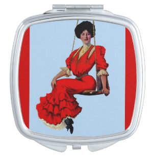 1907 pretty lady on a swing makeup mirror
