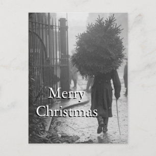 1915: A soldier carrying a christmas tree Holiday Postcard