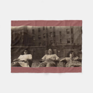 1940s three people relaxing on the roof fleece blanket