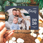 1 photo Christmas arch modern minimalist blue Holiday Card<br><div class="desc">This elegant and modern Christmas greeting card features a minimalist design displaying 1 of your favorite family pictures inside a trendy arch frame. Easily customizable with your family name and the current year in stylish serif fonts over a classic blue background.</div>