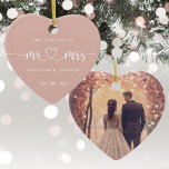 1st Christmas Mr and Mrs Wedding Photo Ceramic Ornament<br><div class="desc">Cherish the timeless elegance of your special day with this exquisite Heart-Shaped Ceramic Ornament. Crafted in a lustrous rose gold hue, this ornament features the endearing 'Mr. & Mrs.' inscription delicately embossed in an elegant script font. The heart-shaped design adds a touch of romance, encasing a beautifully personalized wedding photo...</div>