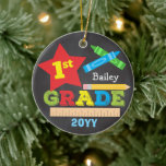 1st Grade First Grade Keepsake Chalkboard Colorful Ceramic Ornament<br><div class="desc">This first grade ornament features a star, a ruler, a pencil, crayons and bold, colorful fun typography! Click the customize button for more options for modifying the text! Variations of this design, additional colors, as well as coordinating products are available in our shop, zazzle.com/store/doodlelulu. Contact us if you need this...</div>