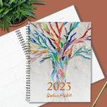 2023 Personalized Planner<br><div class="desc">This unique Planner is decorated with a brightly coloured mosaic tree. Customize it with your name and year. To edit further use the Design Tool to change the font, font size, or color. Because we create our artwork you won't find this exact image from other designers. Original Mosaic © Michele...</div>