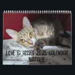 2025 Love & Hisses - NATALIE Calendar<br><div class="desc">The Love & Hisses 2025 calendar featuring our foster Natalie, who unfortunately passed away, but not before making us all fall in love with her. Natalie – a brown tabby and white with fashionable white “boots” – came to us on July 21, 2024. She’d shown up on someone’s doorstep in...</div>