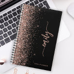 2025 Personalized Black Rose Gold Glitter Planner<br><div class="desc">Personalize this elegant modern design with your name in vertical rose pink signature handwriting script on a black background trimmed with a rose gold faux glitter border. Add the year in sans serif font. (To keep the swashes at the beginning and end of the name, replace only the letters, leaving...</div>