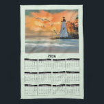 2026 Calendar of a White Lighthouse in Sunset Kitchen Towel<br><div class="desc">A 2026 kitchen calendar of the beautiful image of a white lighthouse with a bright orange sunset on a pale green background. This towel would look wonderful in your home.</div>