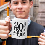 2026 Graduate Trendy Black Graduation Coffee Mug<br><div class="desc">Be the ultimate, most thoughtful gift-giver and give the modern Graduate Typographic Graduation Mug this upcoming graduation season. Perfect for class of 2026, this mug has been designed with special attention to detail. Not only does this mug feature a bold typography design for the class year, but it also has...</div>