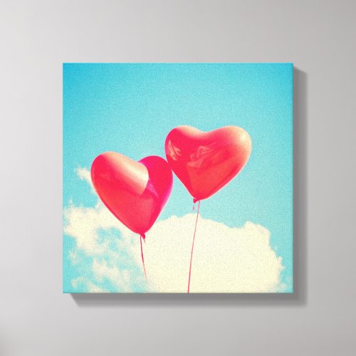 2 Bright Red Heart Shaped balloons Floating Upward Canvas Print