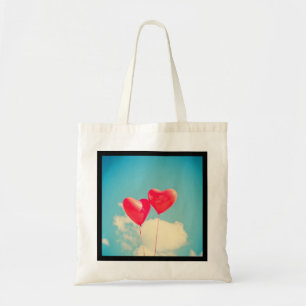 2 Bright Red Heart Shaped balloons Floating Upward Tote Bag