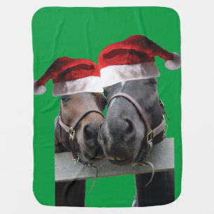 2 horses wearing santa claus hats baby blanket