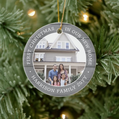 2 Photo First Christmas New Home Faux Gray Wood Ceramic Ornament - Celebrate the joy of your new place with a custom two photo "First Christmas in our New Home" round acrylic ornament. All text and pictures on this template are simple to personalize and can be different or the same on front and back. (IMAGE & TEXT DESIGN TIPS: 1) To adjust position of wording, add spaces at beginning or end. 2) To center the photo exactly how you want, crop it into a square shape before uploading to the Zazzle website.) Modern farmhouse style design features a rustic grey faux wood background, stylish typography name and year, and 2 images of your choice. This unique family keepsake adds an elegant touch to Xmas home decorations or makes a thoughtful housewarming realtor gift idea. There's no place like a new home for the holidays!