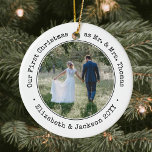 2 Photo Newlyweds First Christmas Black and White Ceramic Ornament<br><div class="desc">Celebrate a joyful 1st holiday as a married couple with a custom 2 photo "Our First Christmas as Mr. & Mrs." round ceramic ornament. All text and images on this template are simple to personalize and can be different or the same on front and back. (IMAGE & TEXT DESIGN TIPS:...</div>
