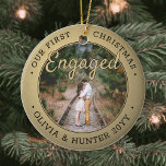 2 Photo Our First Christmas Engaged Black and Gold Ceramic Ornament<br><div class="desc">Celebrate the joyful 1st holiday of your engagement with a custom 2 photo "Our First Christmas Engaged" black and gold round ceramic ornament. All text and images on this template are simple to personalize and can be different or the same on front and back. (IMAGE & TEXT DESIGN TIPS: 1)...</div>