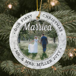 2 Photo Our First Christmas Married Faux Marble Ceramic Ornament<br><div class="desc">Celebrate a joyful 1st holiday as Mr. & Mrs. with a custom 2 photo "Our First Christmas Married" round ceramic ornament. All text and images on this template are simple to personalize. As an idea, the script typography can read "Together" or "Engaged." (IMAGE & TEXT DESIGN TIPS: 1) To adjust...</div>