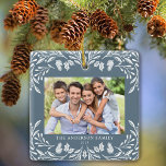 2 Photos Family Winter Greenery Blue Christmas Ceramic Ornament<br><div class="desc">This dark dusty blue Christmas ornament showcases an elegant white winter greenery illustration that frames the photos. The design offers space for 2 pictures,  one on the front and another on the back. Personalize this lovely keepsake ornament with your family name and the year.</div>