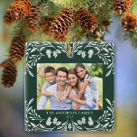 2 Photos Family Winter Greenery Christmas Ceramic Ornament<br><div class="desc">This dark green square Christmas ornament features an elegant white winter greenery illustration that frames the horizontal photo. The design offers space for 2 pictures,  one on the front and another on the back. Personalize this lovely keepsake ornament with your family name and the year.</div>
