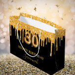 30th birthday black gold glitter drips name large gift bag<br><div class="desc">A chic black background. Decorated with faux gold glitter drips,  paint dripping look. Personalize and add a name.  With the text:  Happy Birthday.  The name is written with a mode hand lettered style script.   Number 30 is written with a balloon style font.</div>