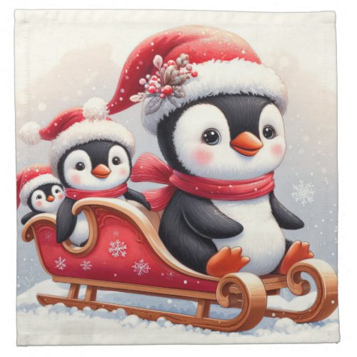 3 cute penguins in a sleigh cloth napkin