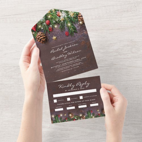 3 in 1 Rustic Christmas Winter Wedding All In One Invitation - Rustic 3 in 1 winter wedding tri-fold invitation featuring a dark wooden background, festive christmas tree branches, red & gold tree decorations, string twinkle lights, a wedding invite, and a rsvp meal option section for your guests to tear off and send back.