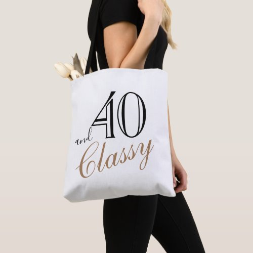 40 and Classy Elegant Black Golden Script Birthday Tote Bag - 40 and Classy Elegant Black Golden Script Birthday Tote Bag. Elegant design with trendy script in black and golden colors. The bag is a great gift for a woman celebrating her 40th birthday.