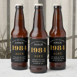 40th Birthday Name 1984 Black Gold Elegant Chic<br><div class="desc">1984 Vintage 40th Birthday Black & Gold Elegant Beer Label. Celebrate your milestone with our exclusive 1984 Vintage 40th birthday beer label. The meticulously designed label with stunning black and gold hues effortlessly enhances the visual appeal of your favorite beer. The year 1984, prominently featured on the label, adds a...</div>