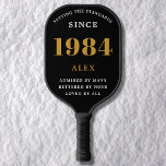 40th Birthday Name 1984 Black Gold Elegant Chic Pickleball Paddle<br><div class="desc">Chic '1984' 40th Birthday Black and Gold Personalized Pickleball Paddle - Elegant Design for Sports Enthusiasts. Celebrate a significant milestone in style with our chic '1984' 40th birthday black and gold pickleball paddle. Elegantly designed and fully personalized, this paddle blends birthday charm and utility in one. Ideal for anyone with...</div>