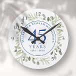 45th 65th Wedding Anniversary Greenery Round Clock<br><div class="desc">Featuring delicate soft watercolor leaves,  this chic botanical sapphire wedding anniversary design can be personalized with your special anniversary information in elegant text. Designed by Thisisnotme©</div>